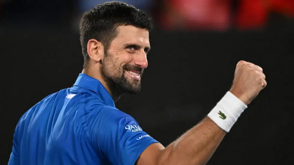 Novak Djokovic advanced to the third round of the Australian Open, surpassing Roger Federer's record for the most major singles matches played.